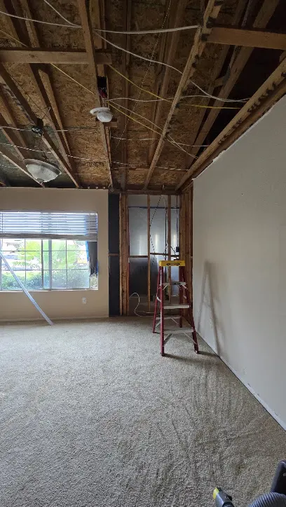 Roof and storm leak water damage in a Sun City, CA attic and ceiling